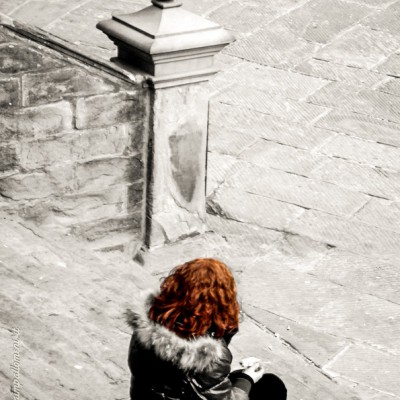 Red hair girl on ancient stairs